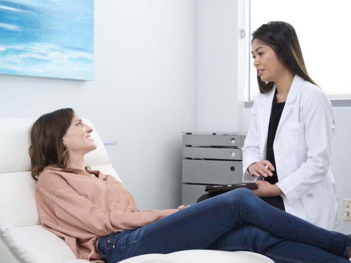 Dr. Tran caring for a patient at Ketamine Wellness Clinic or Orange County